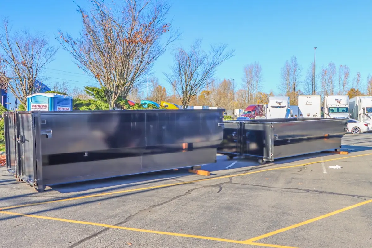 Professional dumpster rental service with roll-off container on residential driveway in Knightdale